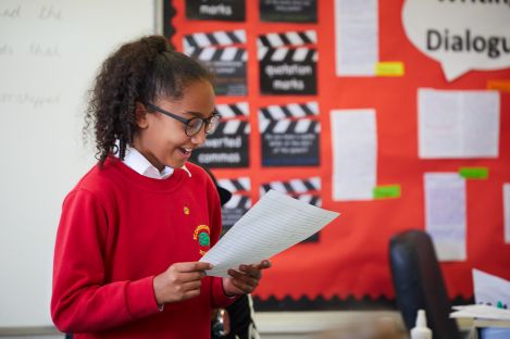 A student looking at a sheet of paper