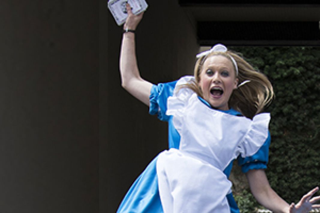 Jumping person in alice costume