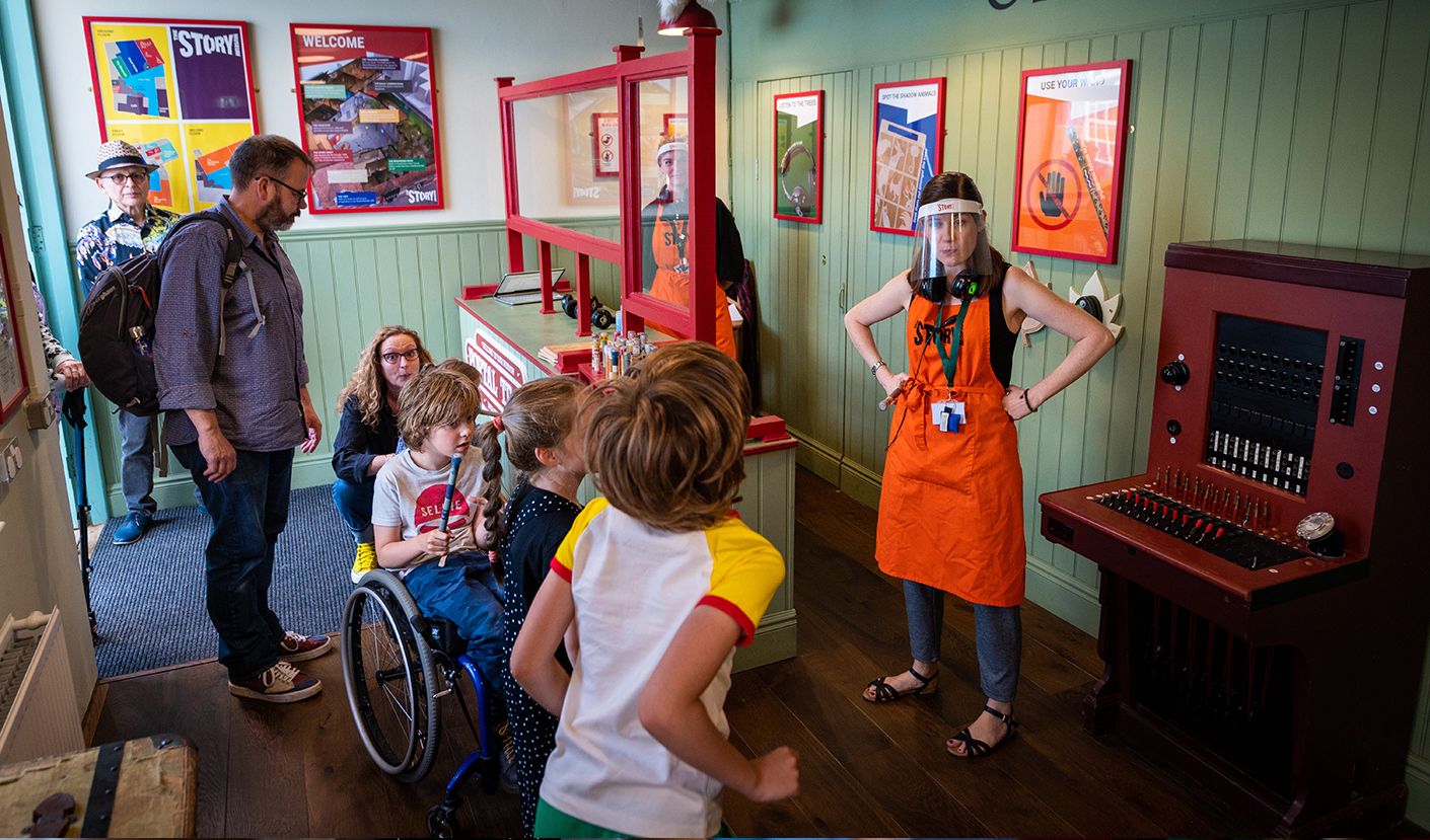 A family being welcomed in the portal