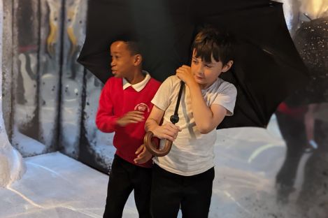 Two students in the Narnia story installation