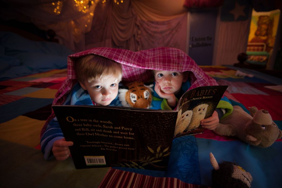 Two children on the giant Story Bed