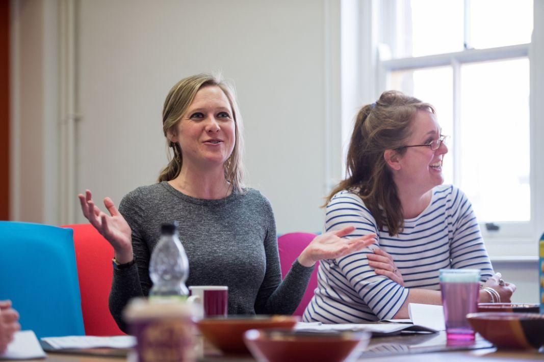 Two teachers smiling