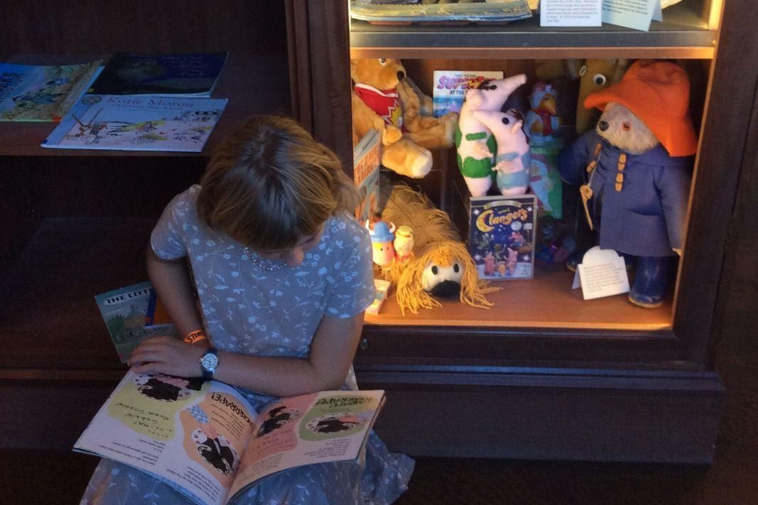 A Ukrainian child reading a book at The Story Museum