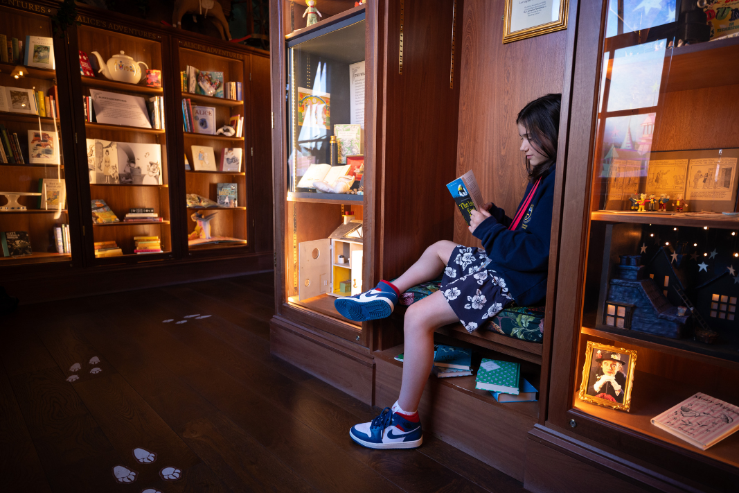 Child reading in the Enchanted library
