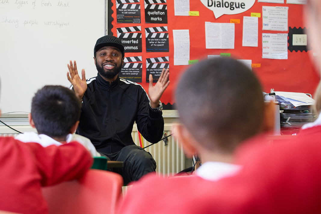 A storyteller telling a story to students