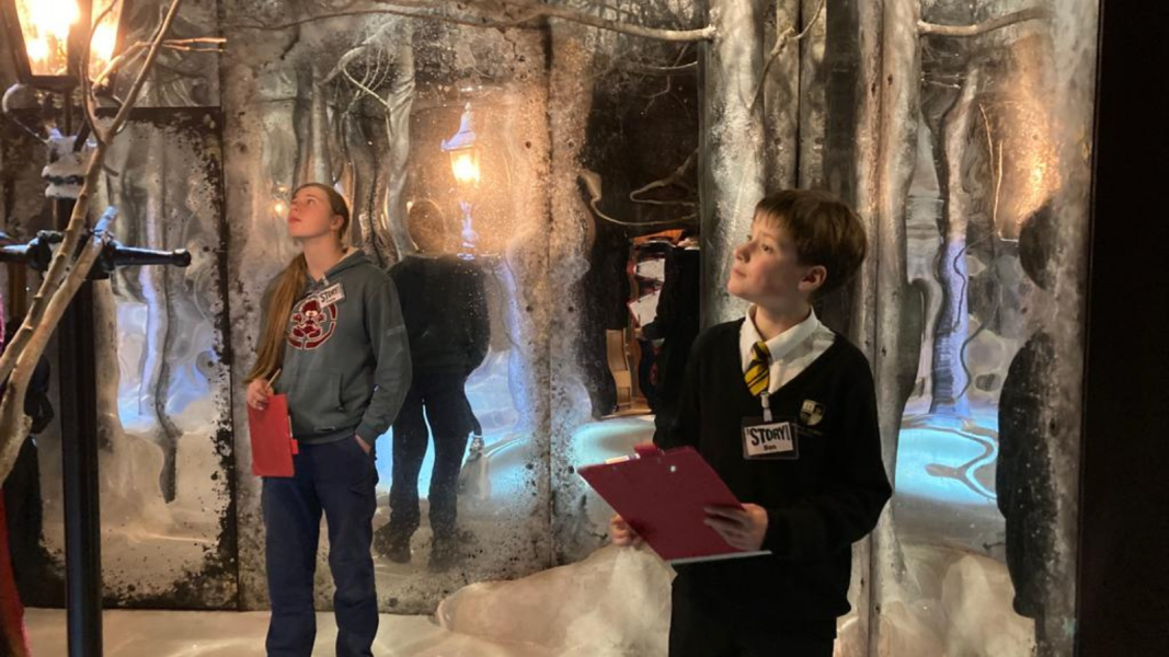 Two students in the Narnia story installation